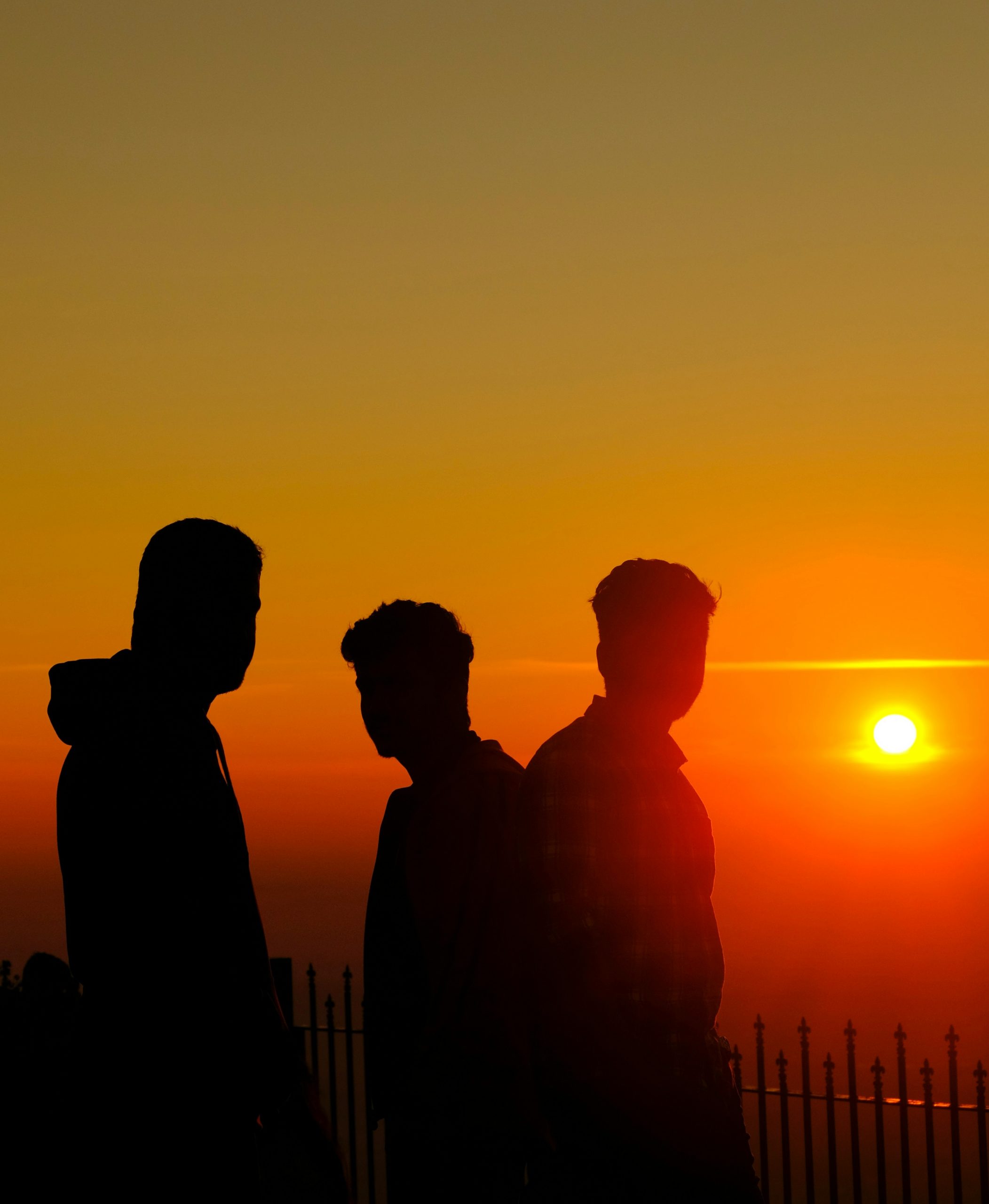 Three silhouettes against a sunset — triangulation